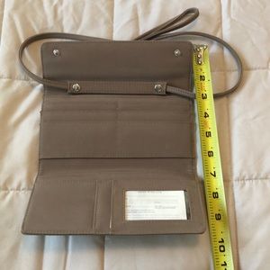 Clutch with cross body strap